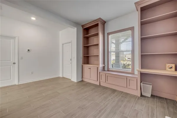 a kitchen with stainless steel appliances kitchen island granite countertop a refrigerator and a stove top oven