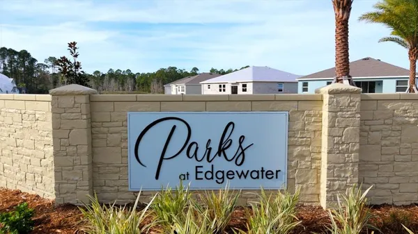 a front view of a building with sign board