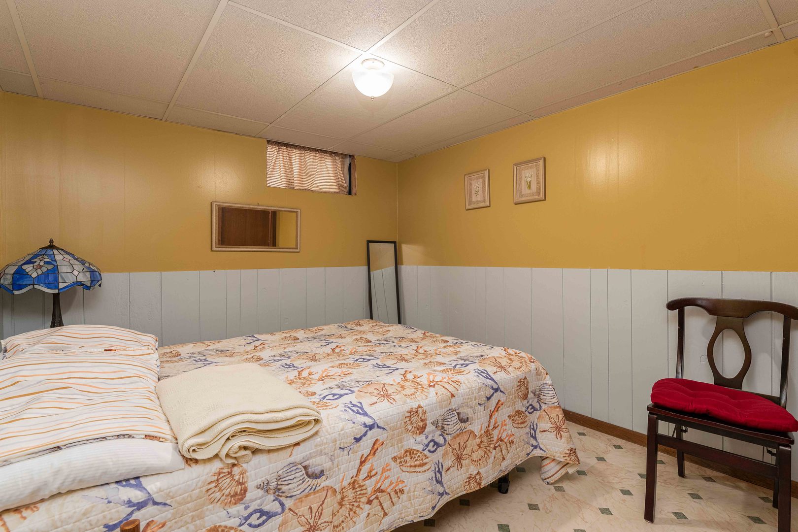 115 Eagle Point Road Fox Lake, IL 60020 - Photo 10 of 18 a bedroom with a bed and a chair