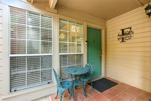a view of balcony with a potted plant