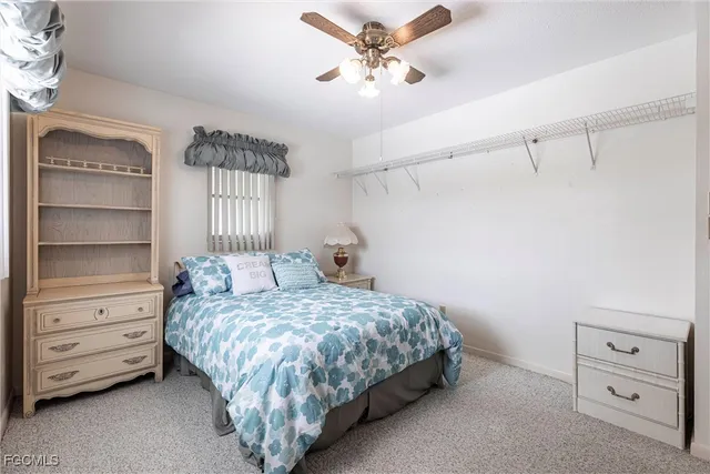 a bedroom with a bed and a cabinet