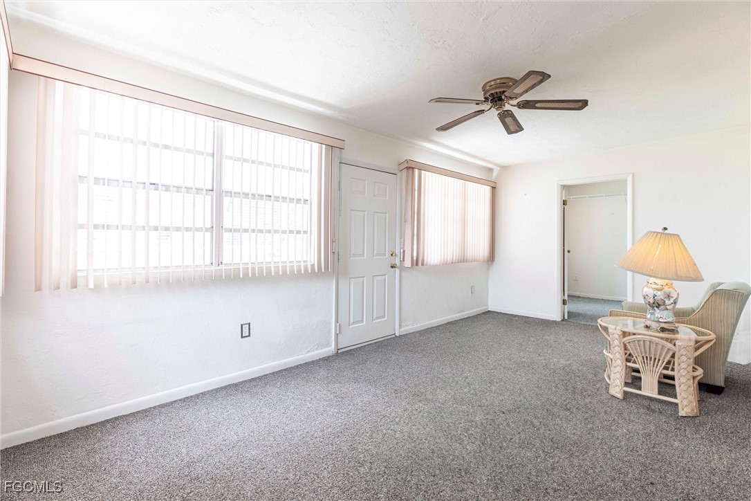365 Westpark Road Lehigh Acres, FL 33936 - Photo 13 of 15 a living room with furniture and a window