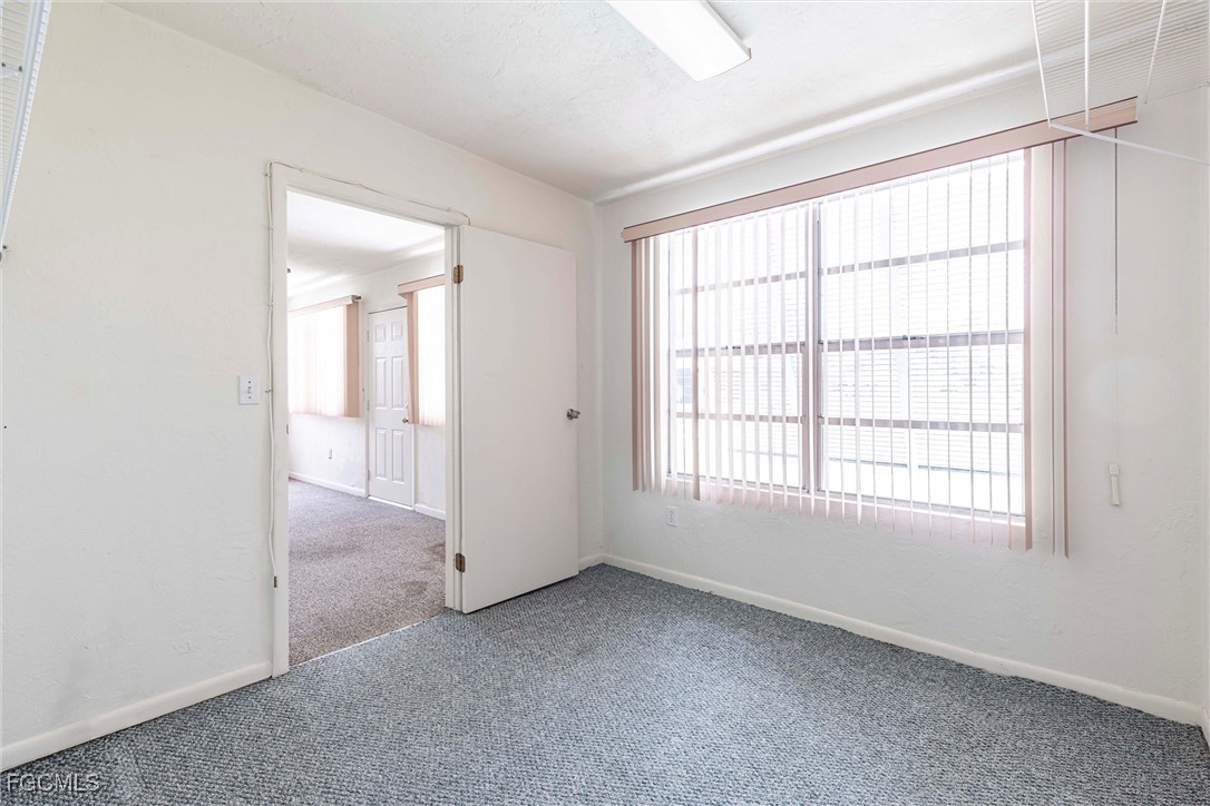 365 Westpark Road Lehigh Acres, FL 33936 - Photo 15 of 15 an empty room with windows and closet