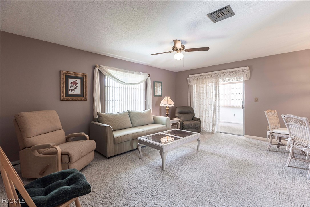 365 Westpark Road Lehigh Acres, FL 33936 - Photo 3 of 15 a living room with furniture