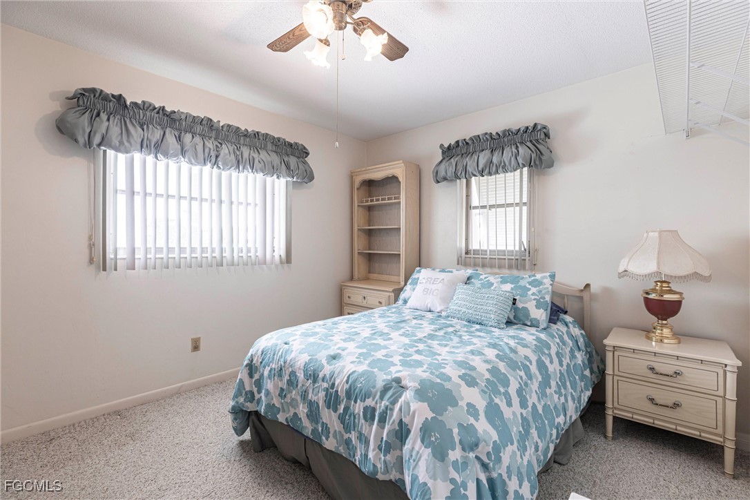 365 Westpark Road Lehigh Acres, FL 33936 - Photo 10 of 15 a bedroom with a bed and window