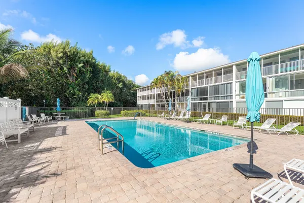 a view of a swimming pool with a patio