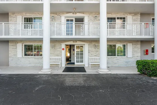 a front view of a house with many windows