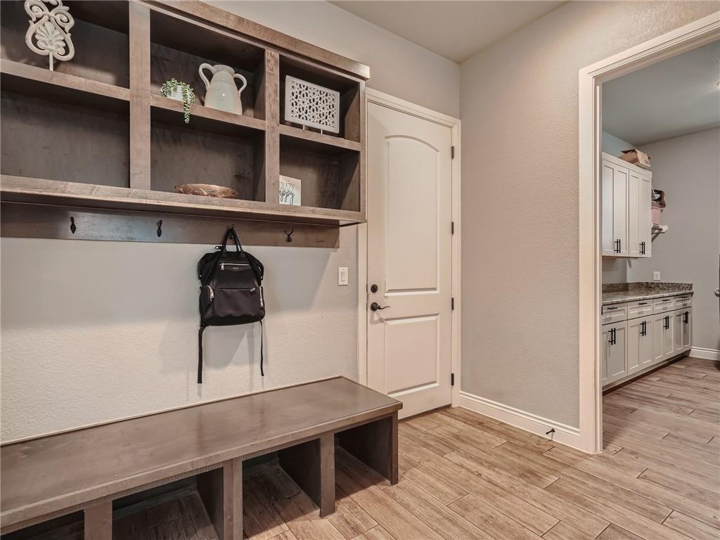 132 Huerta Road Florence, TX 76527 - Photo 26 of 40 A functional mudroom entry with built-in storage and convenient hooks awaits, adjoining a well-appointed utility space.