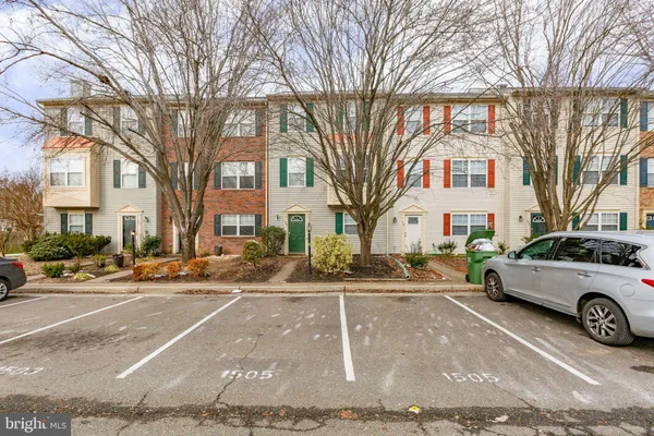 a view of a cars parked on the side of a street