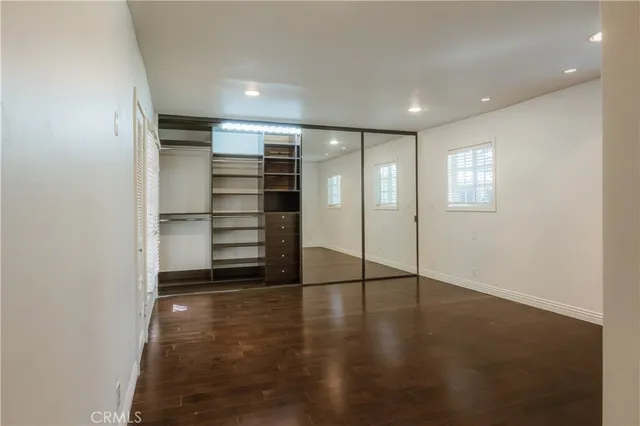 a view of an empty room with a closet