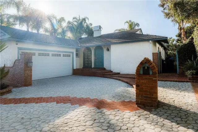 an aerial view of residential houses with city view