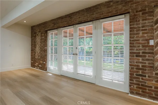 a view of a room with a large window