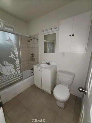 a bathroom with a toilet a sink and bathtub