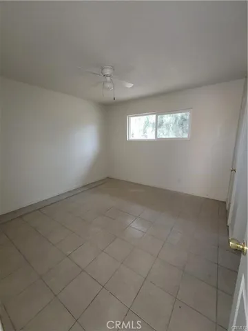 an empty room with windows and entrance