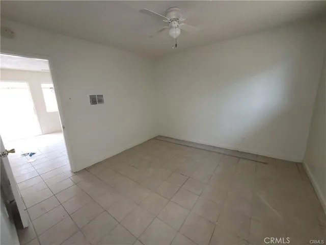 an empty room with a fireplace