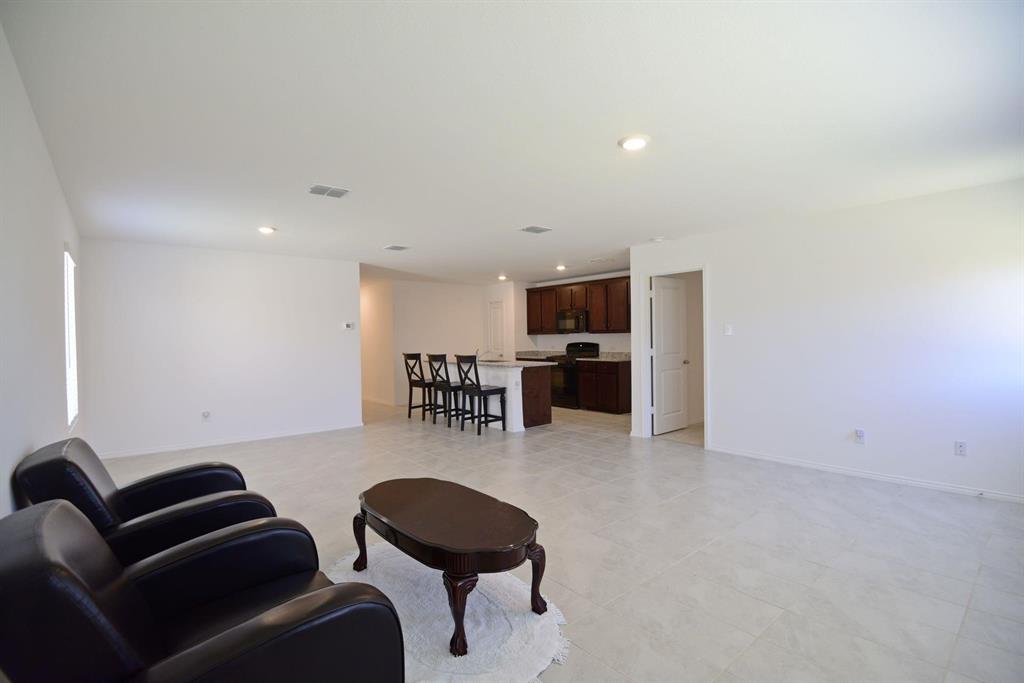 14133 Aberavon Drive Pilot Point, TX 76258 - Photo 17 of 18 a living room with furniture and a table