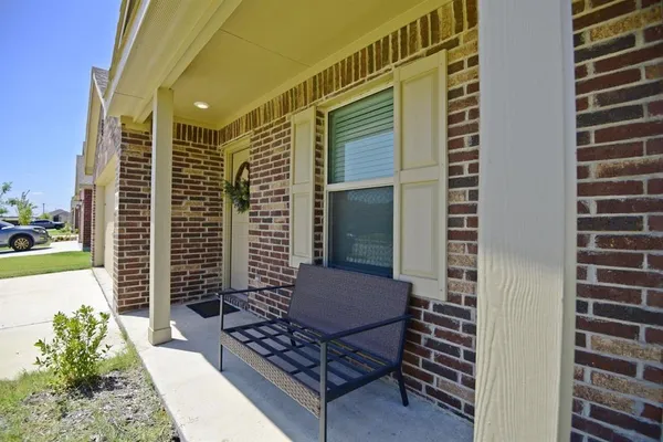 a view of balcony with wooden floor