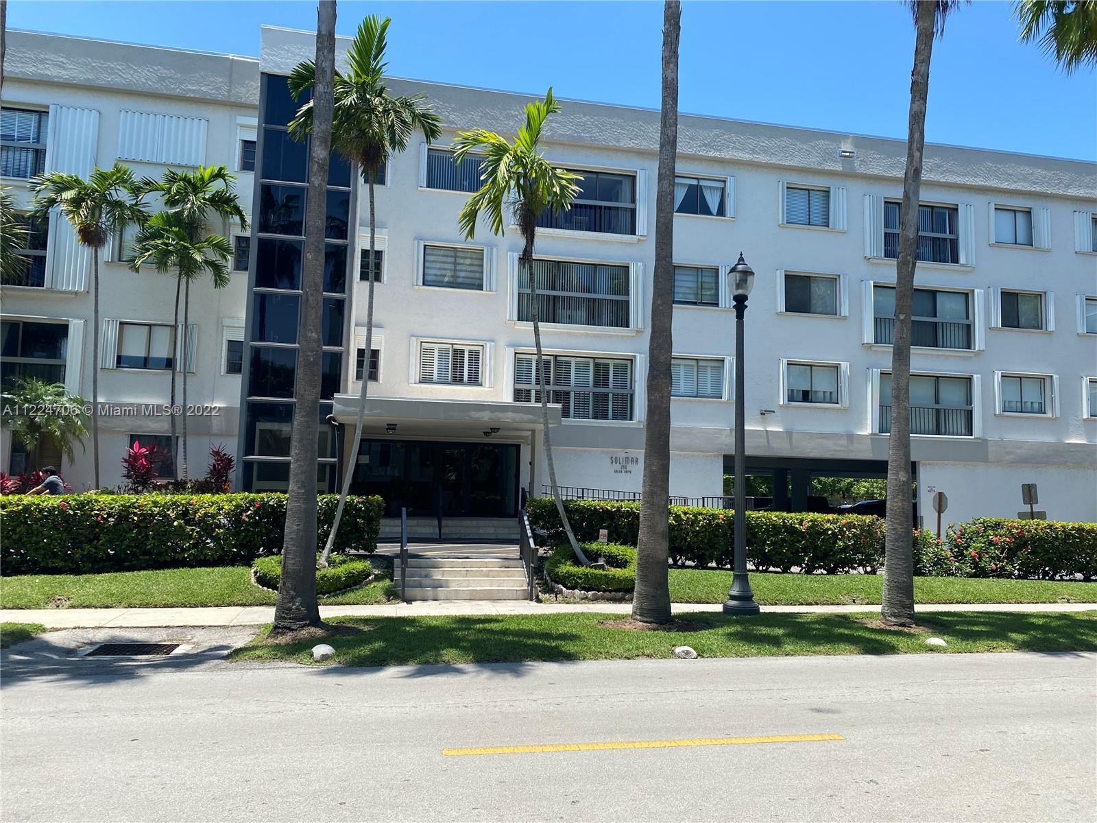 255 Galen Drive, Unit 2I Key Biscayne, FL 33149 - Photo 1 of 14 a house view with garden space and tall windows
