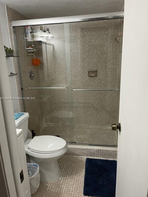 255 Galen Drive, Unit 2I Key Biscayne, FL 33149 - Photo 11 of 14 a bathroom with a toilet and a shower