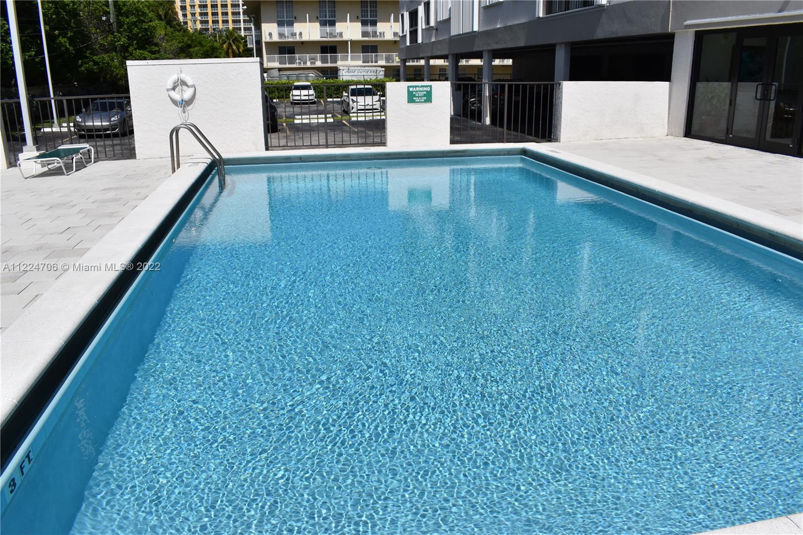 255 Galen Drive, Unit 2I Key Biscayne, FL 33149 - Photo 3 of 14 a swimming pool with a outdoor space