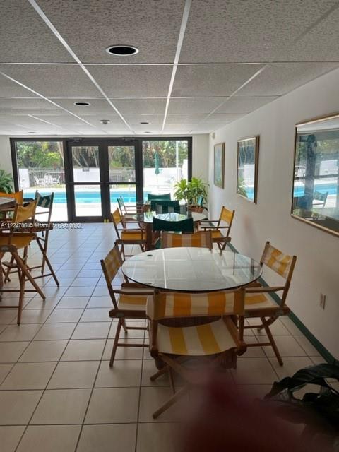 255 Galen Drive, Unit 2I Key Biscayne, FL 33149 - Photo 4 of 14 a view of a dining room with furniture window and outside view
