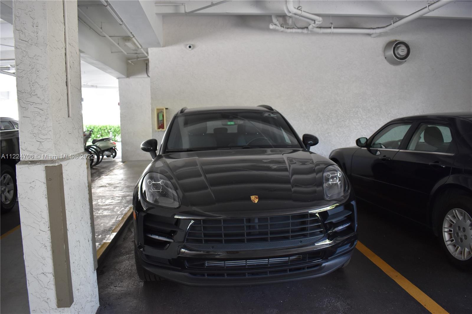255 Galen Drive, Unit 2I Key Biscayne, FL 33149 - Photo 5 of 14 a view of car parked in garage