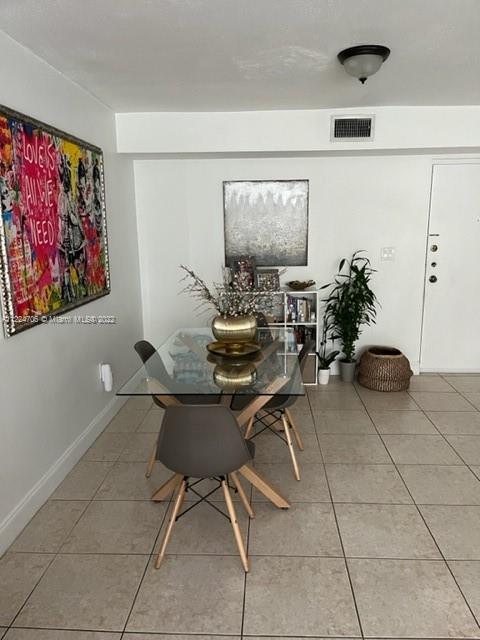 255 Galen Drive, Unit 2I Key Biscayne, FL 33149 - Photo 7 of 14 a work room with furniture and a potted plant