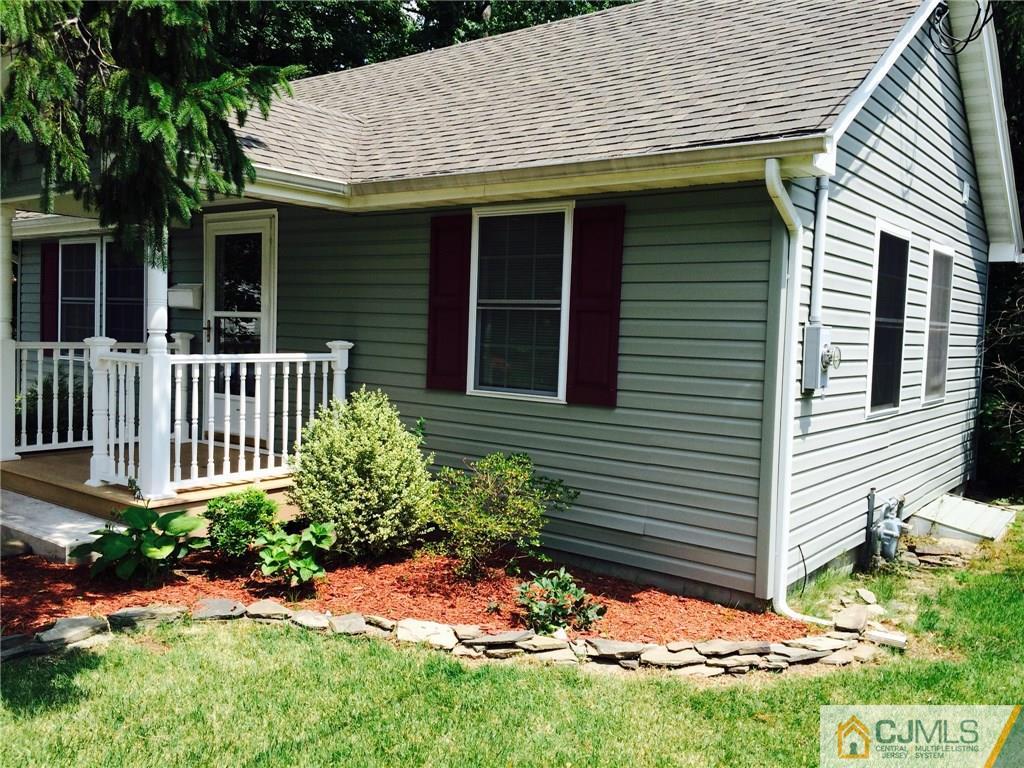 1134 Matawan Road Old Bridge, NJ 08879 - Photo 3 of 12 a view of a house with a yard and plants