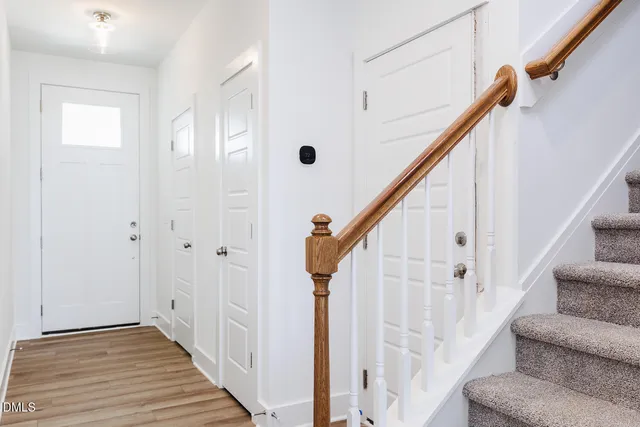 a view of a hallway with staircase