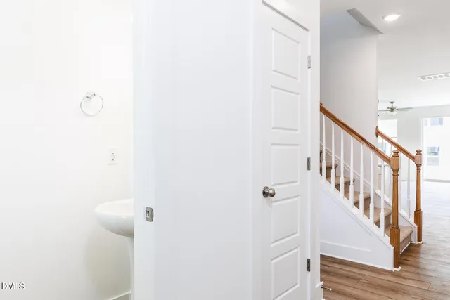 a bathroom with a sink a mirror and a window