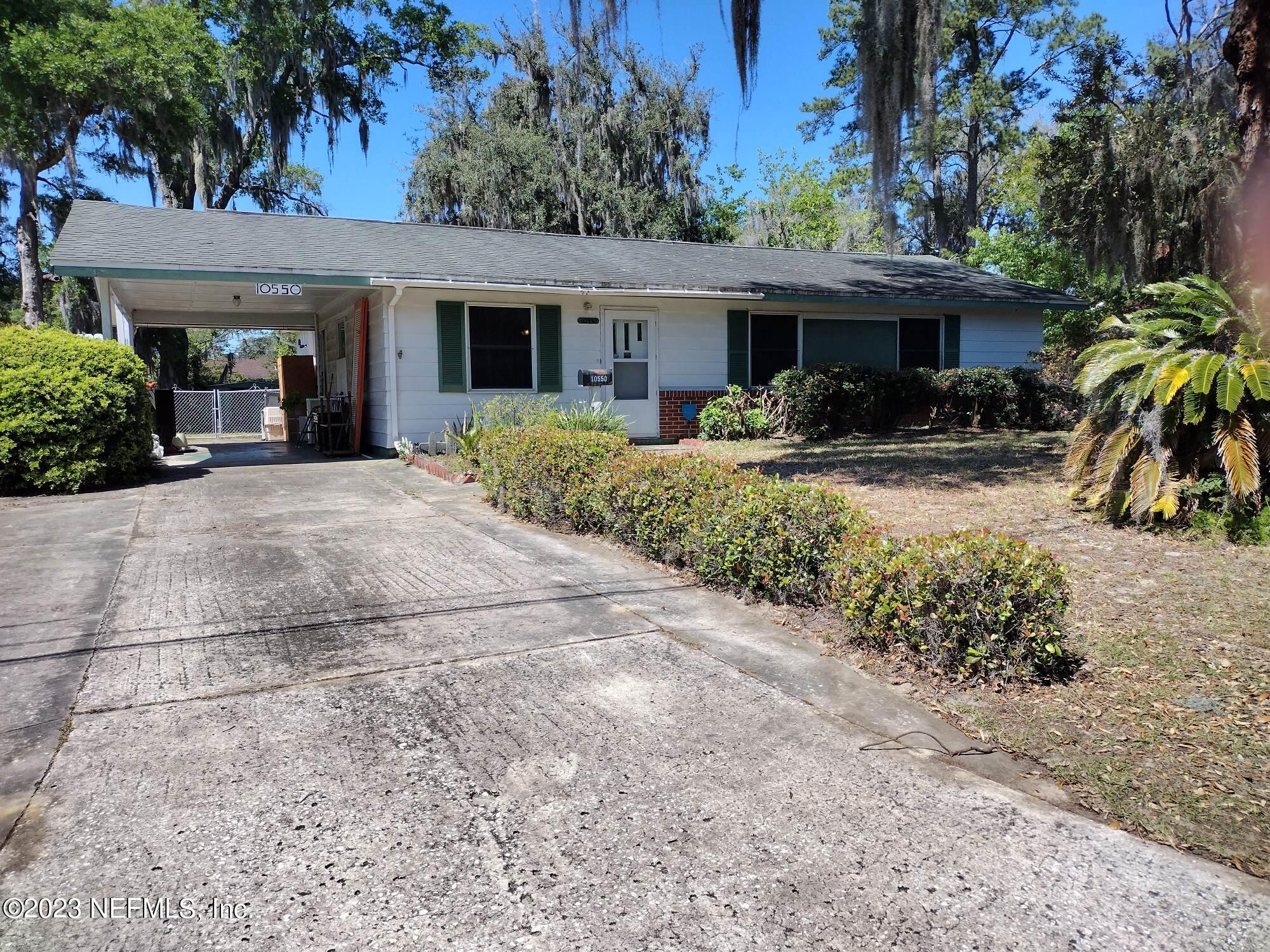 10550 Dodd Road Jacksonville, FL 32218 - Photo 1 of 1 a view of a house with a patio