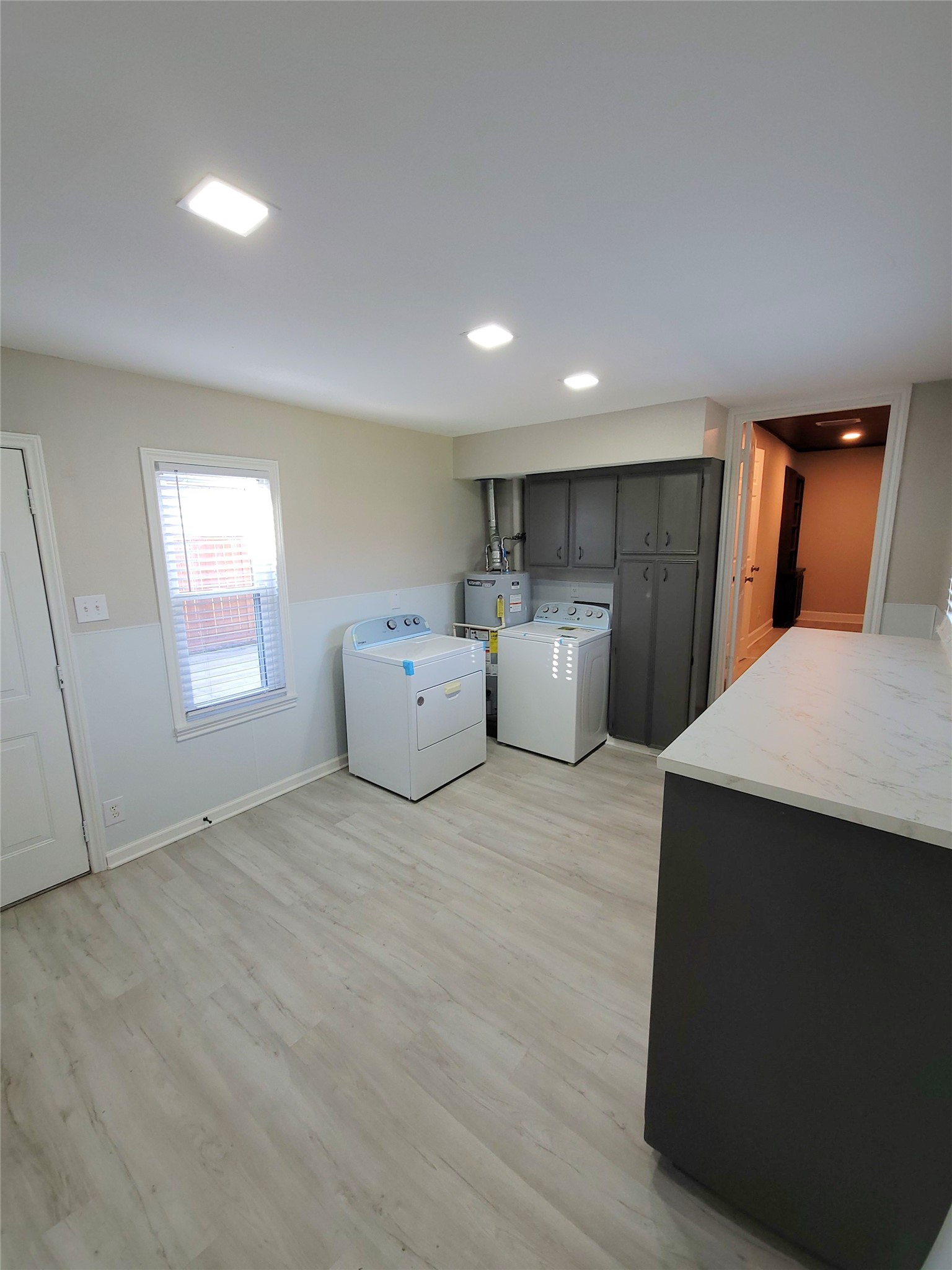 628 King Street Houston, TX 77022 - Photo 13 of 24 Huge utility room with custom built in cabinets with access to private driveway