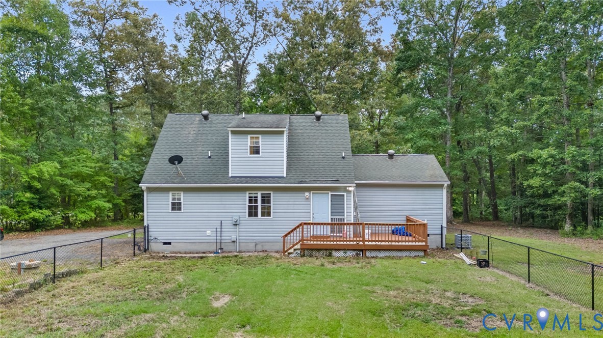 2869 Newville Road Disputanta, VA 23842 - Photo 25 of 26 Exterior featuring light gray siding, a wood-finis