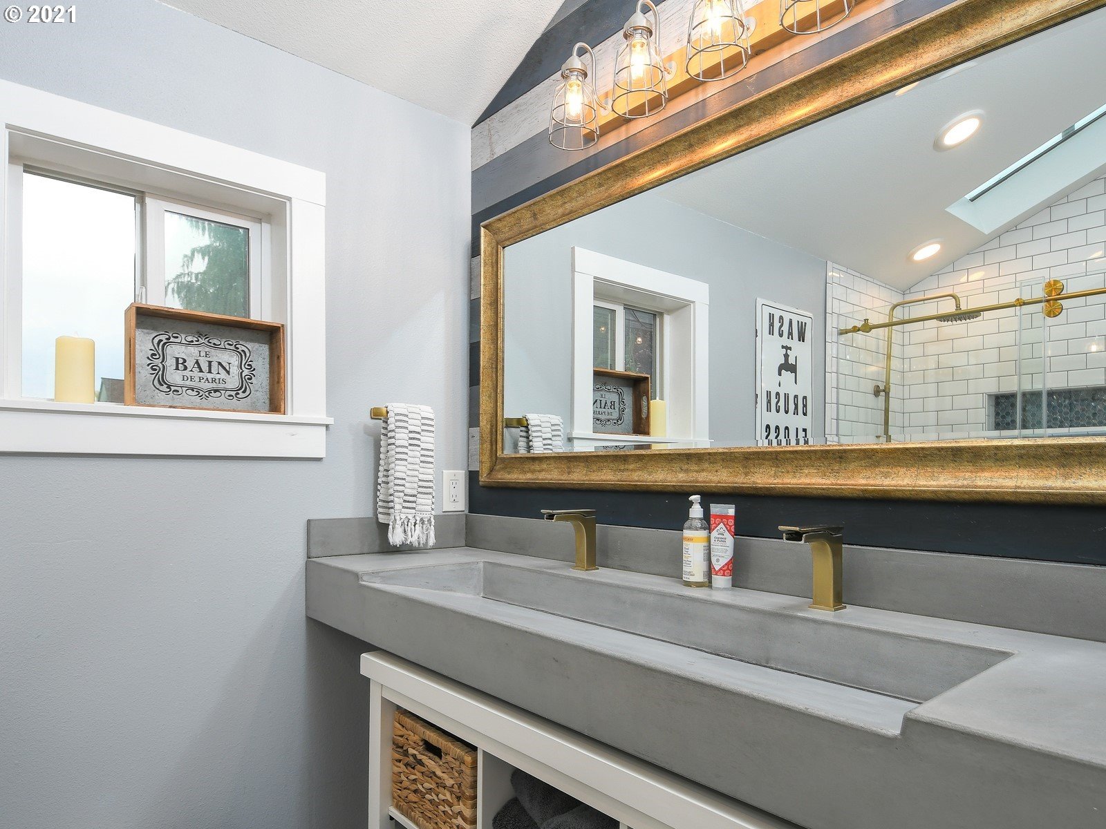 115 South 4th Avenue Ridgefield, WA 98642 - Photo 15 of 32 a bathroom with a sink and a mirror