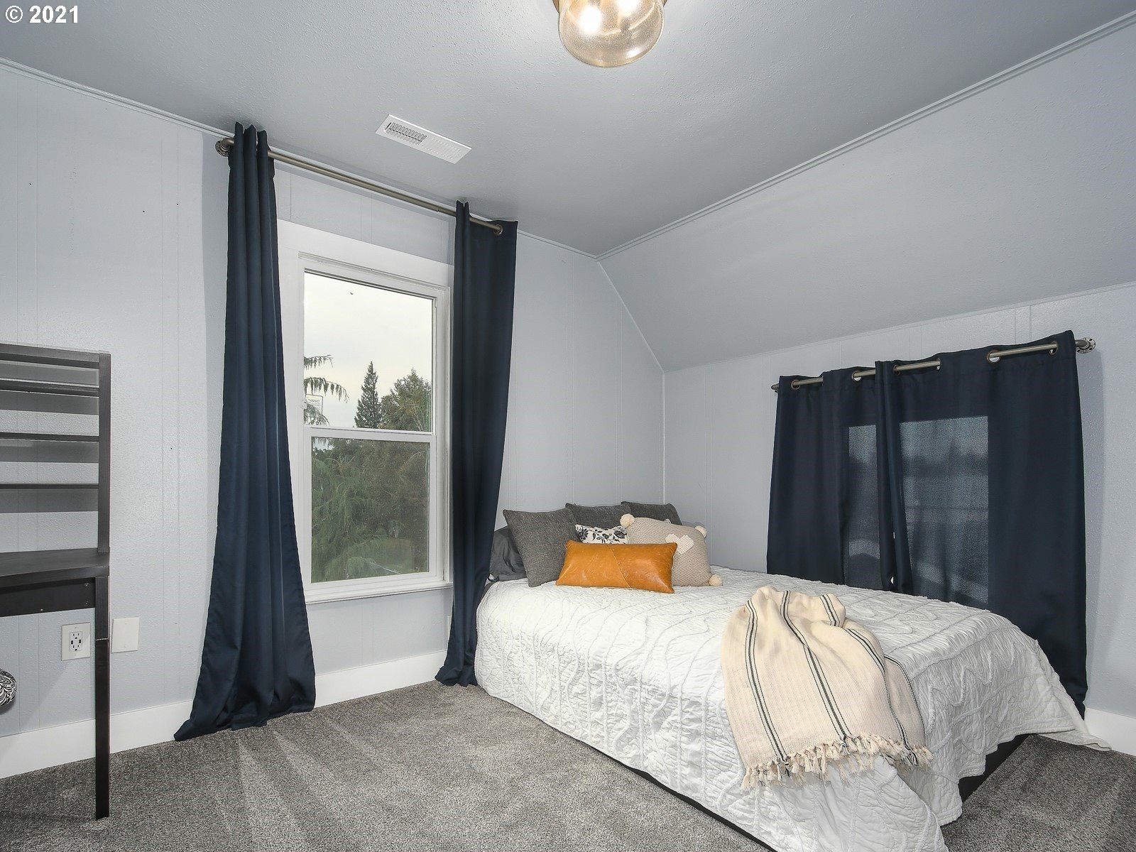 115 South 4th Avenue Ridgefield, WA 98642 - Photo 17 of 32 a bedroom with a bed and window
