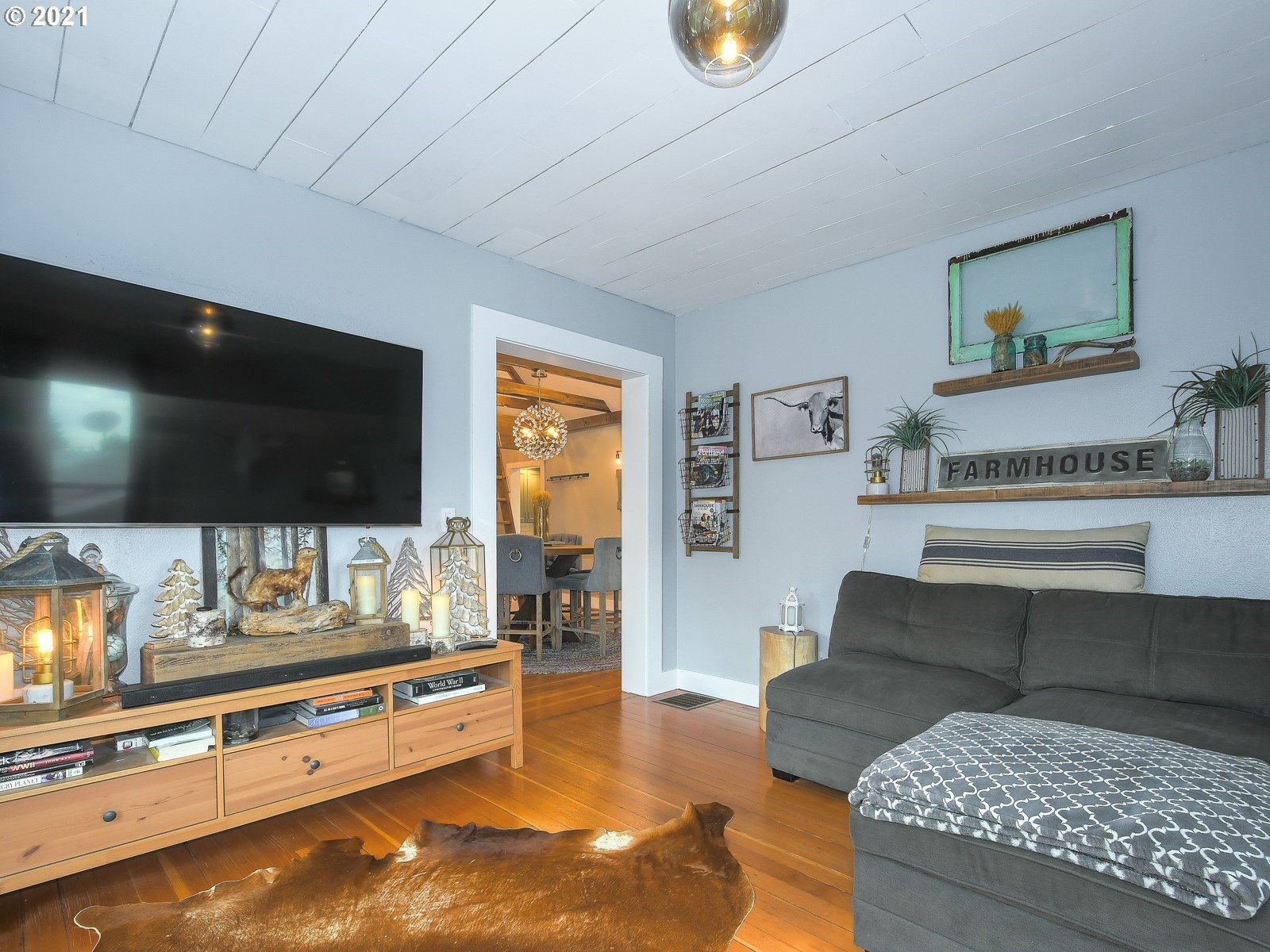 115 South 4th Avenue Ridgefield, WA 98642 - Photo 5 of 32 a living room with furniture and a flat screen tv