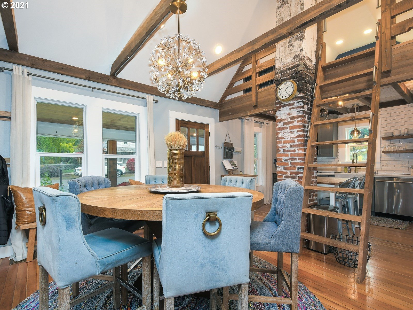 115 South 4th Avenue Ridgefield, WA 98642 - Photo 6 of 32 a view of a dining room with furniture window and wooden floor