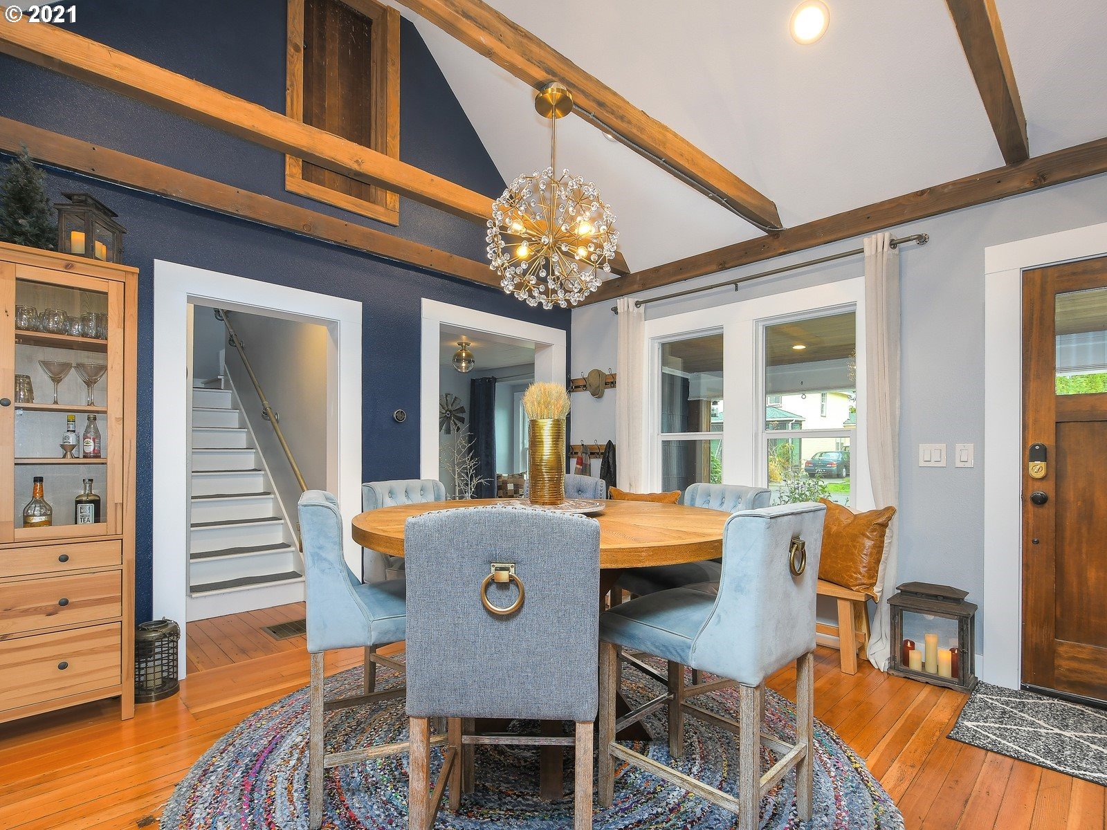 115 South 4th Avenue Ridgefield, WA 98642 - Photo 7 of 32 a view of a dining room with furniture wooden floor and chandelier