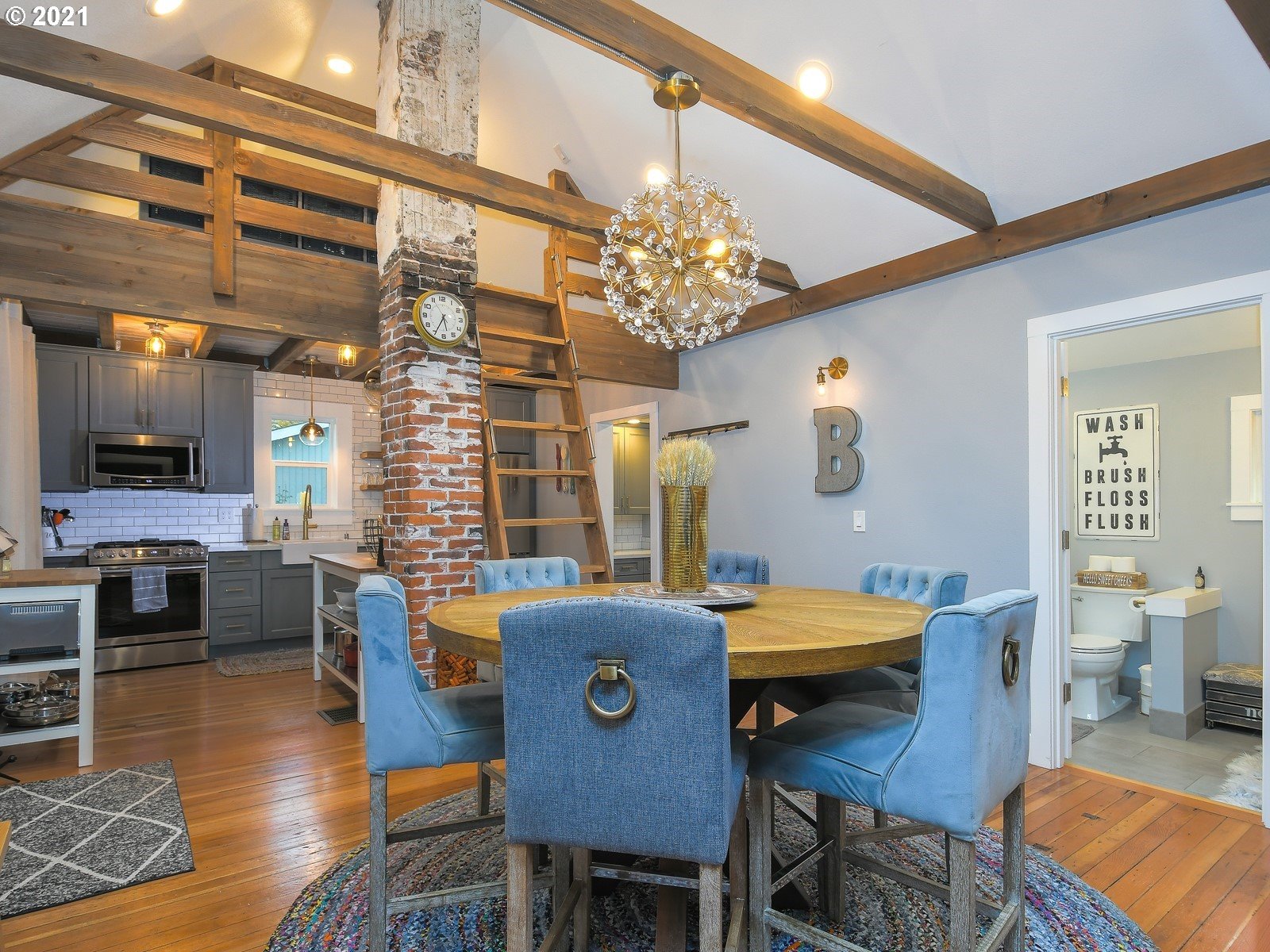 115 South 4th Avenue Ridgefield, WA 98642 - Photo 8 of 32 a view of a dining room with furniture window and wooden floor