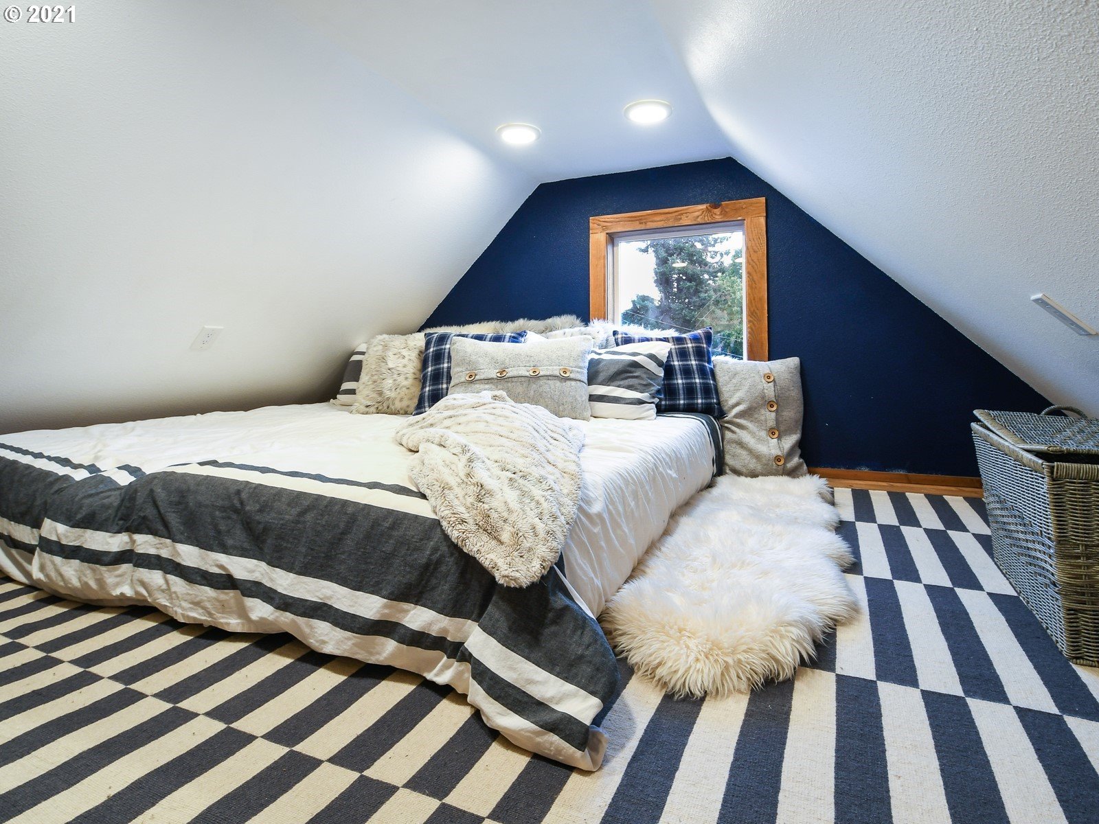 115 South 4th Avenue Ridgefield, WA 98642 - Photo 9 of 32 a bedroom with a bed and wooden floor