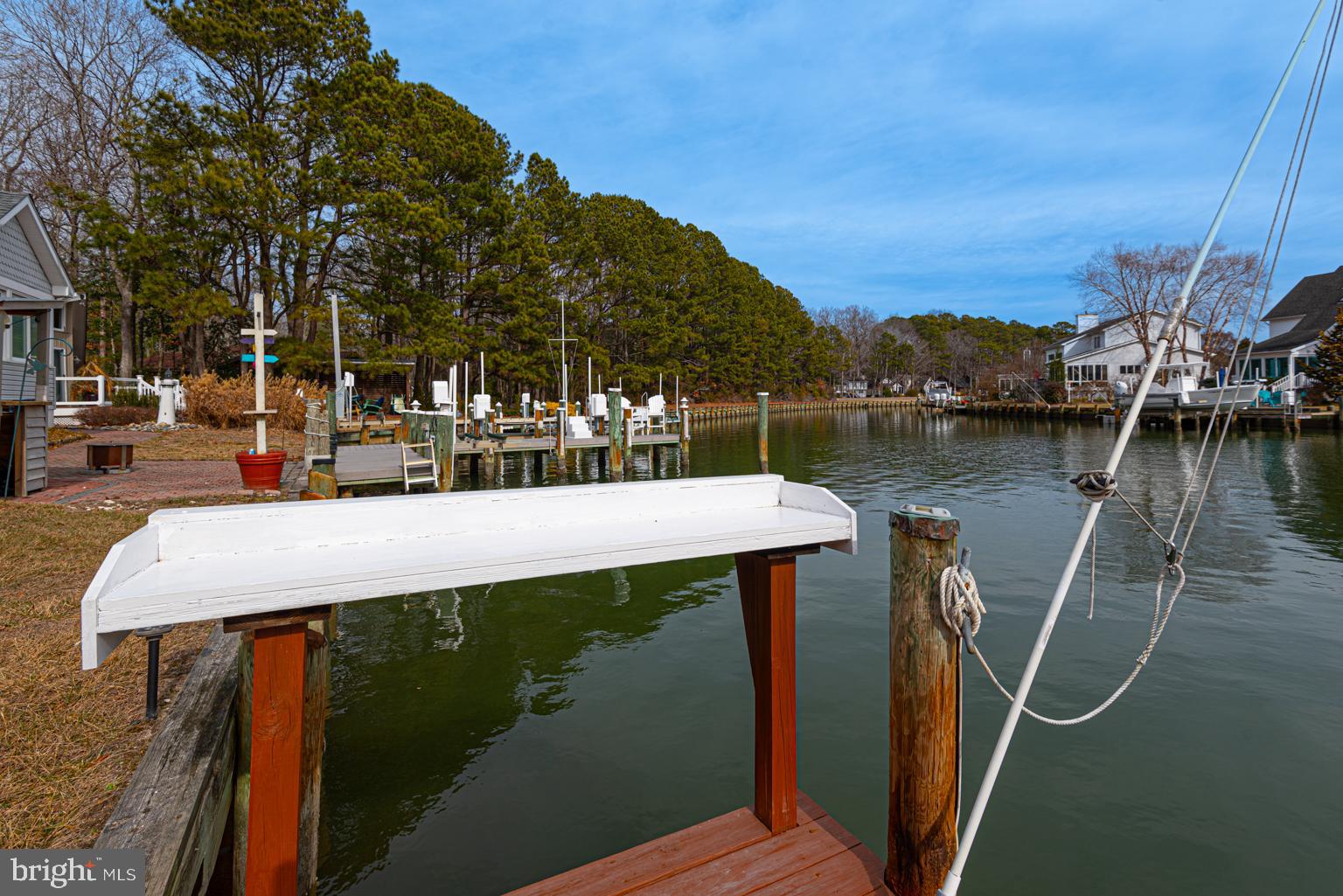 116 Watertown Road Ocean Pines, MD 21811 - Photo 12 of 78 a view of a lake with a house in the background