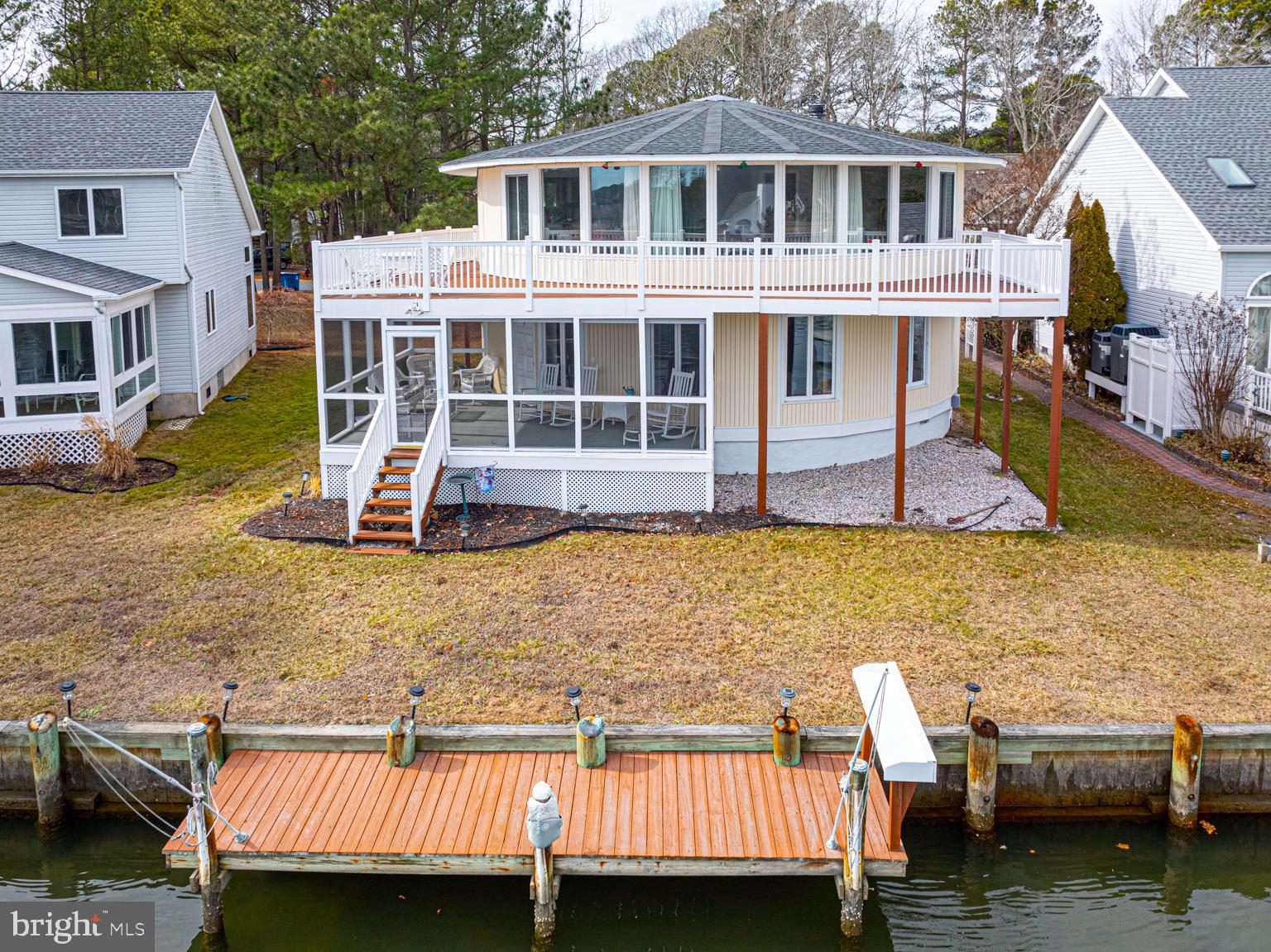 116 Watertown Road Ocean Pines, MD 21811 - Photo 2 of 78 a view of a house with pool chairs and a yard