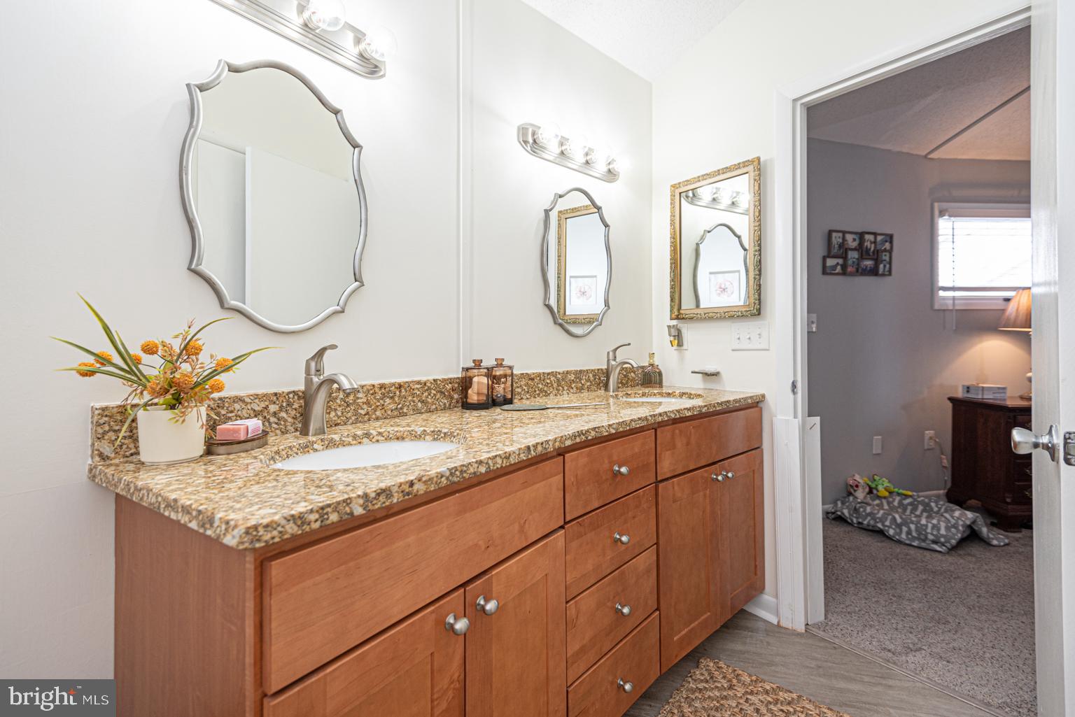 116 Watertown Road Ocean Pines, MD 21811 - Photo 41 of 78 a bathroom with a granite countertop sink and a mirror