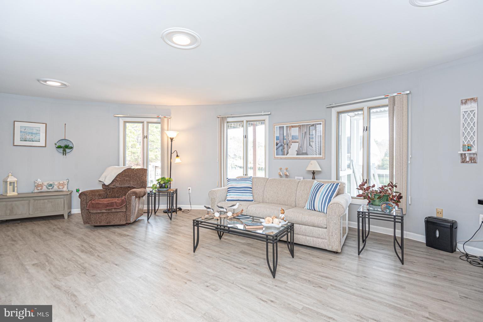 116 Watertown Road Ocean Pines, MD 21811 - Photo 46 of 78 a living room with furniture and a wooden floor