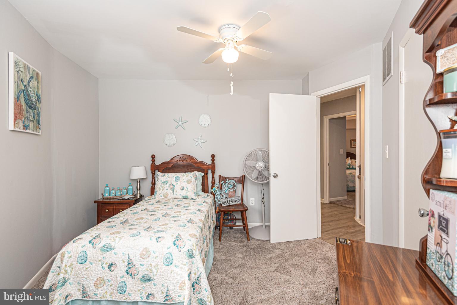 116 Watertown Road Ocean Pines, MD 21811 - Photo 59 of 78 a bed room with a bed and a chandelier