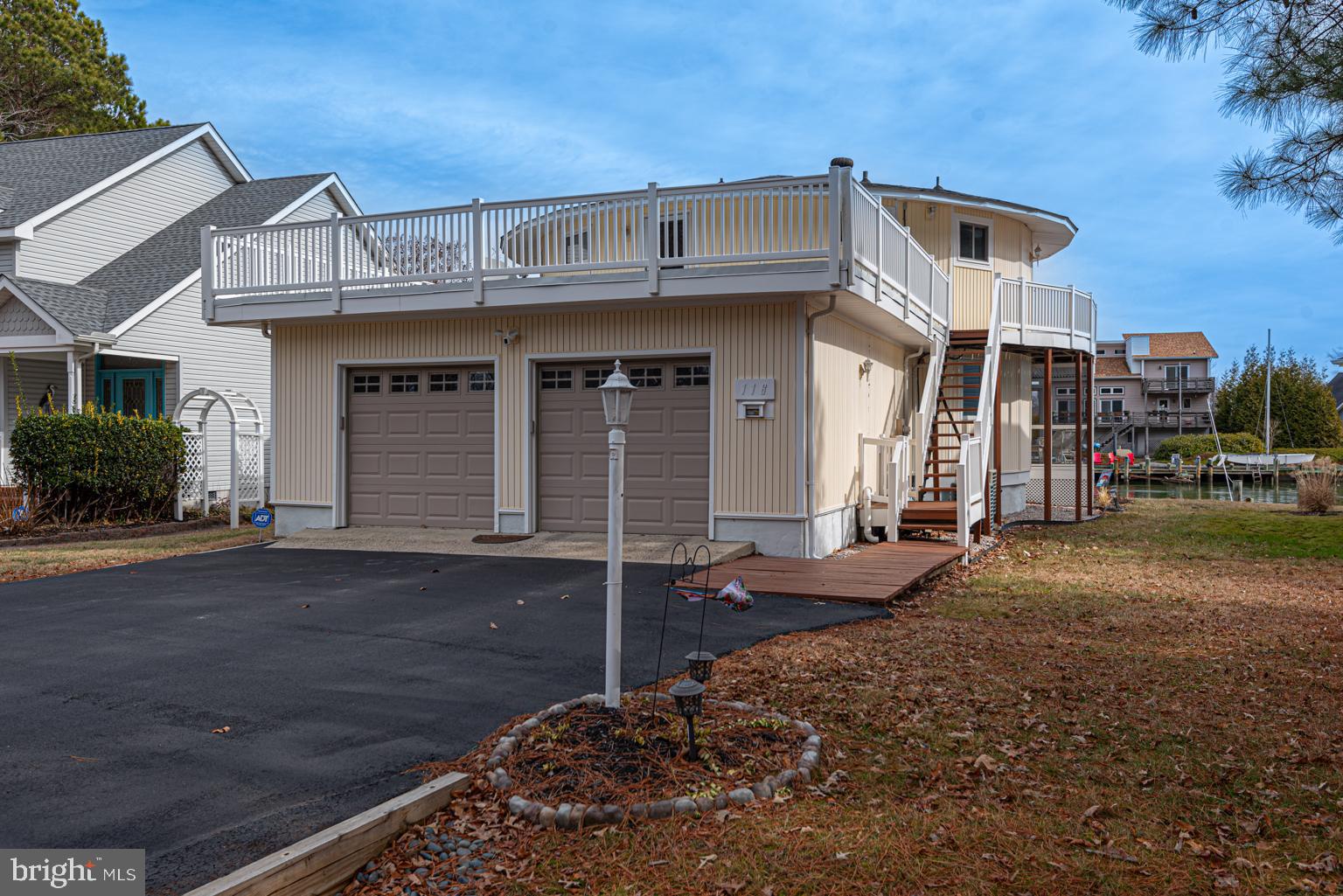 116 Watertown Road Ocean Pines, MD 21811 - Photo 6 of 78 a front view of a house with a yard