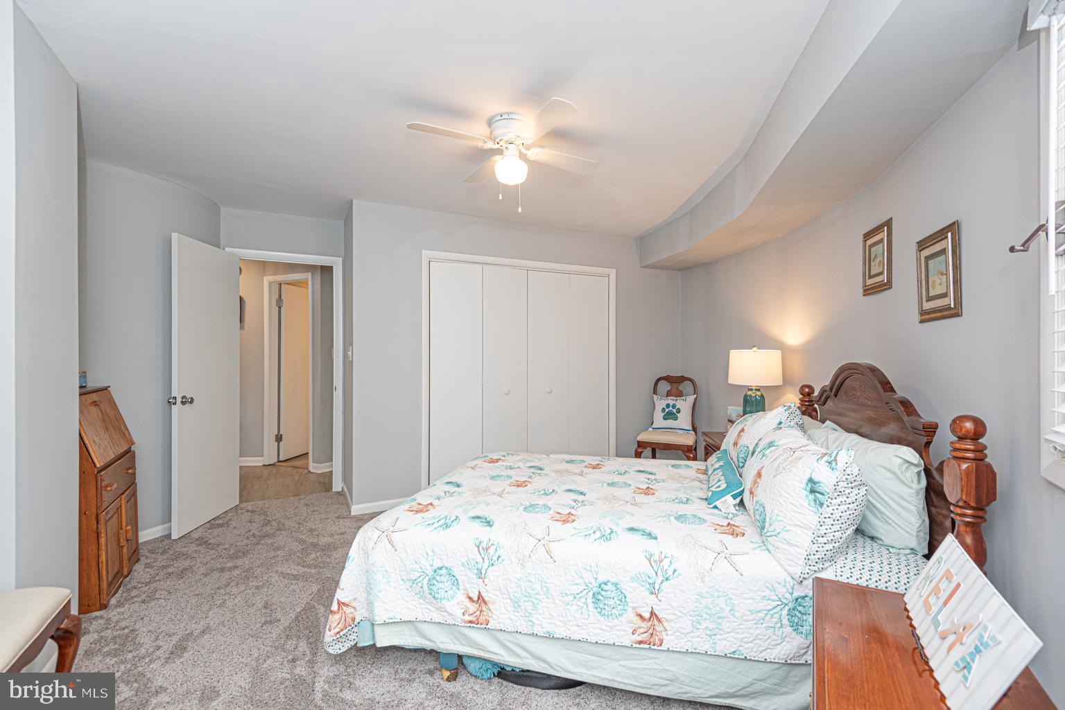 116 Watertown Road Ocean Pines, MD 21811 - Photo 66 of 78 a bedroom with a bed and a chandelier