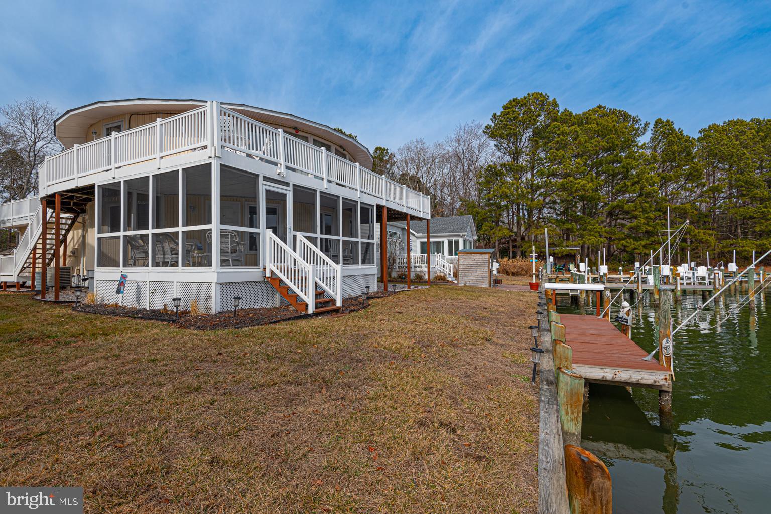 116 Watertown Road Ocean Pines, MD 21811 - Photo 9 of 78 a front view of a house with a garden