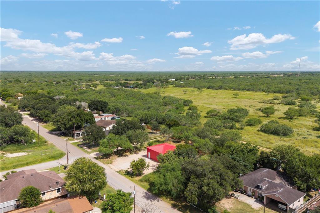 22025 Lane Road Edinburg, TX 78541 - Photo 4 of 8 Aerial view of residential area with a heavily wooded area