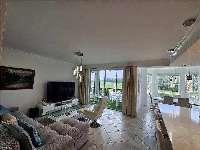 a bed room with a bed and a chair